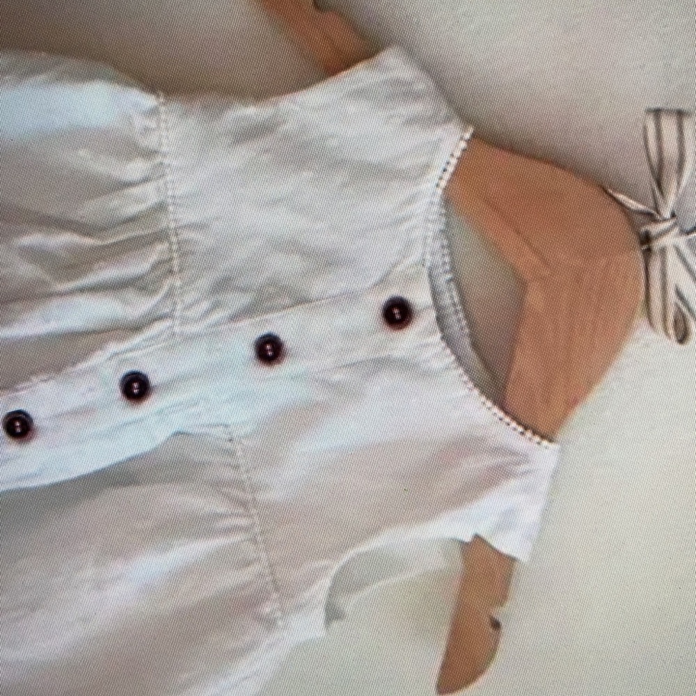 Adorable sleeveless featuring button kids top blouse